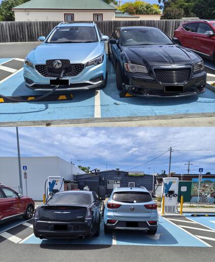 An electric vehicle charging station. A black ICE Dodge SRT has parked in one bay, a blue MG ZS has parked hard up against the Dodge driver's door.