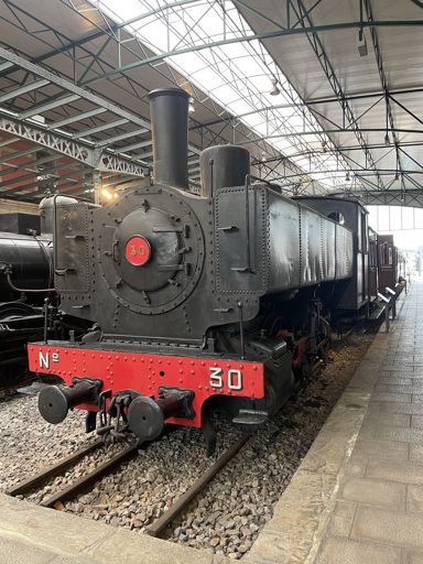A large steam train at a train museum